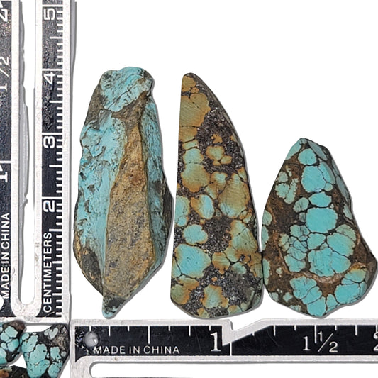 An 18-gram triplet of natural turquoise stones featuring vibrant blue hues with rich brown and golden matrix patterns. Perfect for custom jewelry or lapidary projects, available at www.naturalturquoise.com