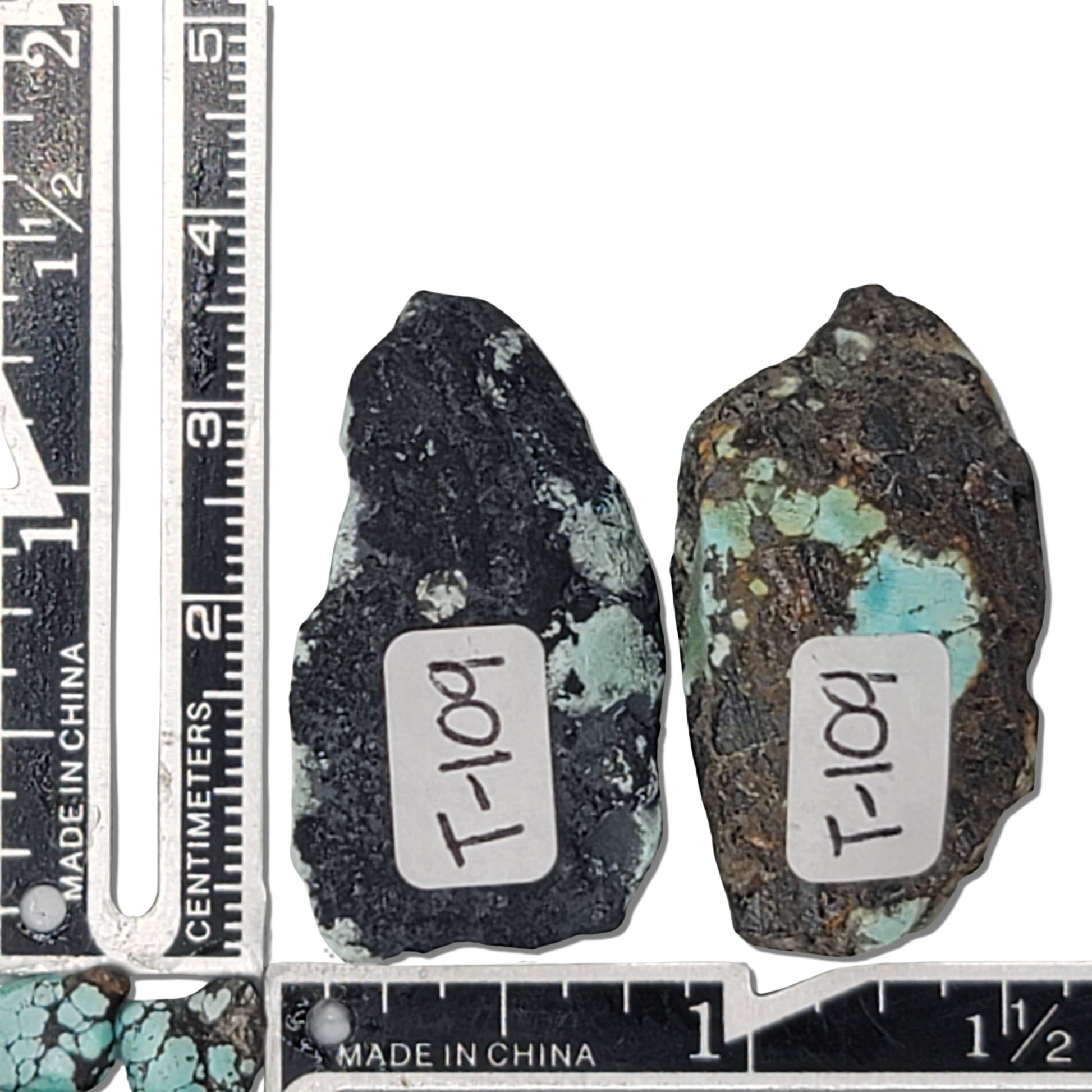 A 27-gram pair of natural turquoise stones with vibrant greenish-blue hues and striking black matrix. Ideal for creating unique jewelry or as a raw collectible, available at www.naturalturquoise.com.






