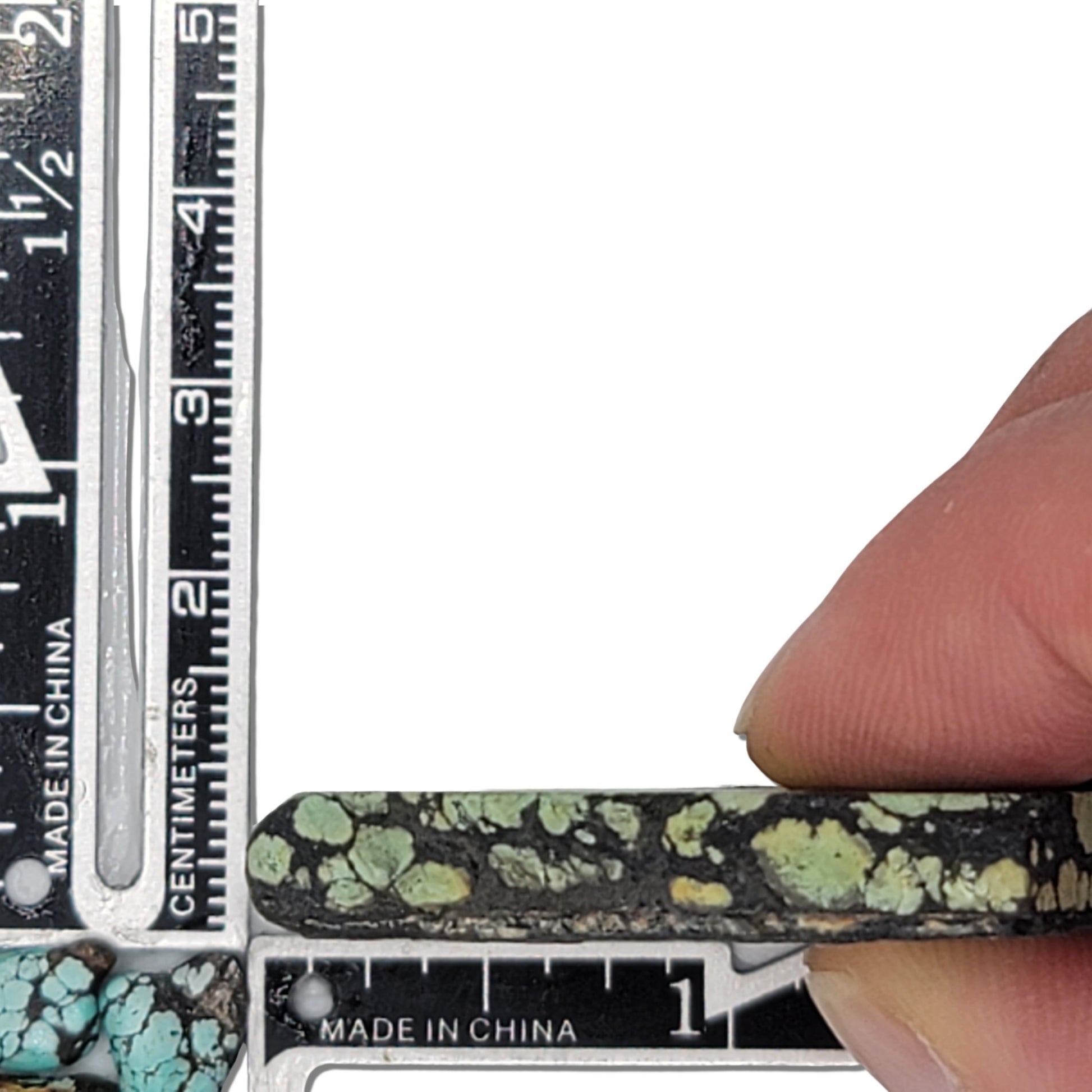 Single rough turquoise stone with green hues and dark webbing matrix, approx. 4 cm x 3 cm, www.naturalturquoise.com.