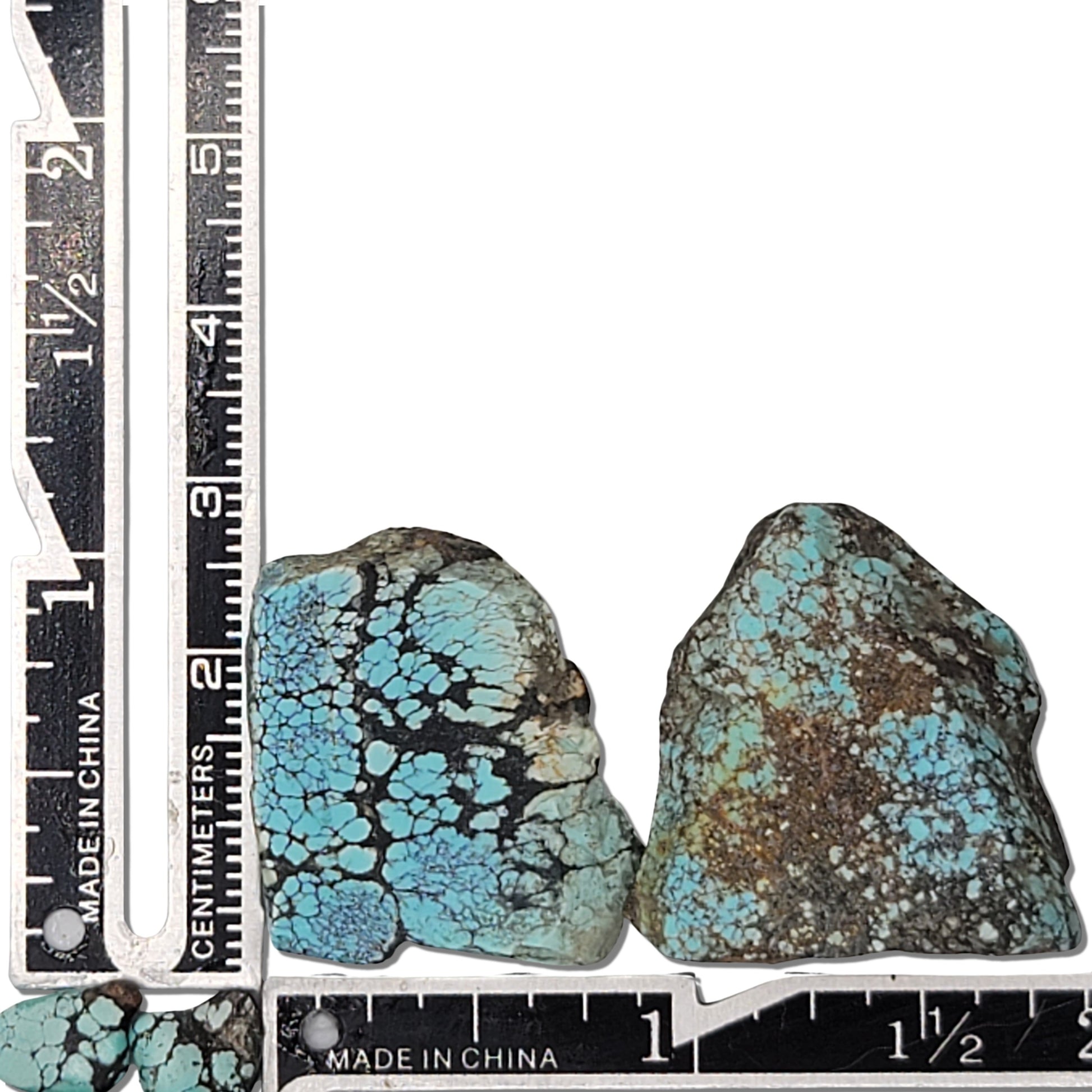 Two rough turquoise stones with intricate blue webbing and earthy brown matrix, approx. 3 cm x 2.5 cm and 3 cm x 2 cm, www.naturalturquoise.com.