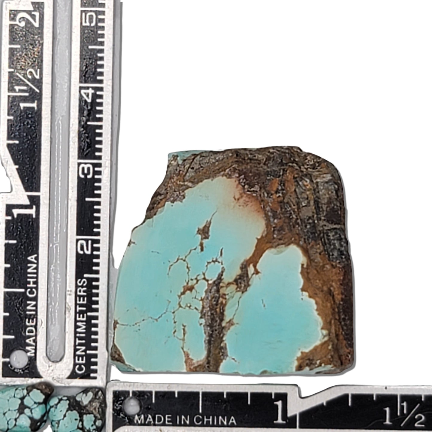 Single rough turquoise stone with soft blue hues and earthy brown matrix, approx. 3 cm x 2.5 cm, www.naturalturquoise.com.