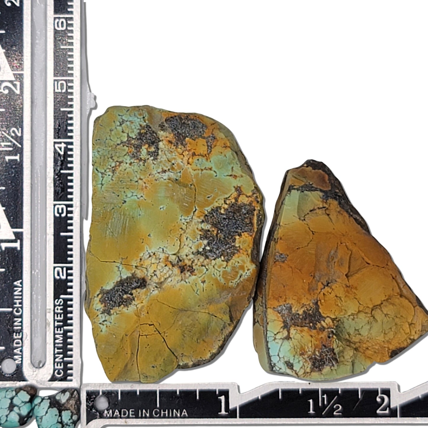 Two rough turquoise stones with earthy green and brown hues and dark matrix, approx. 4 cm x 3 cm and 3 cm x 2 cm, www.naturalturquoise.com