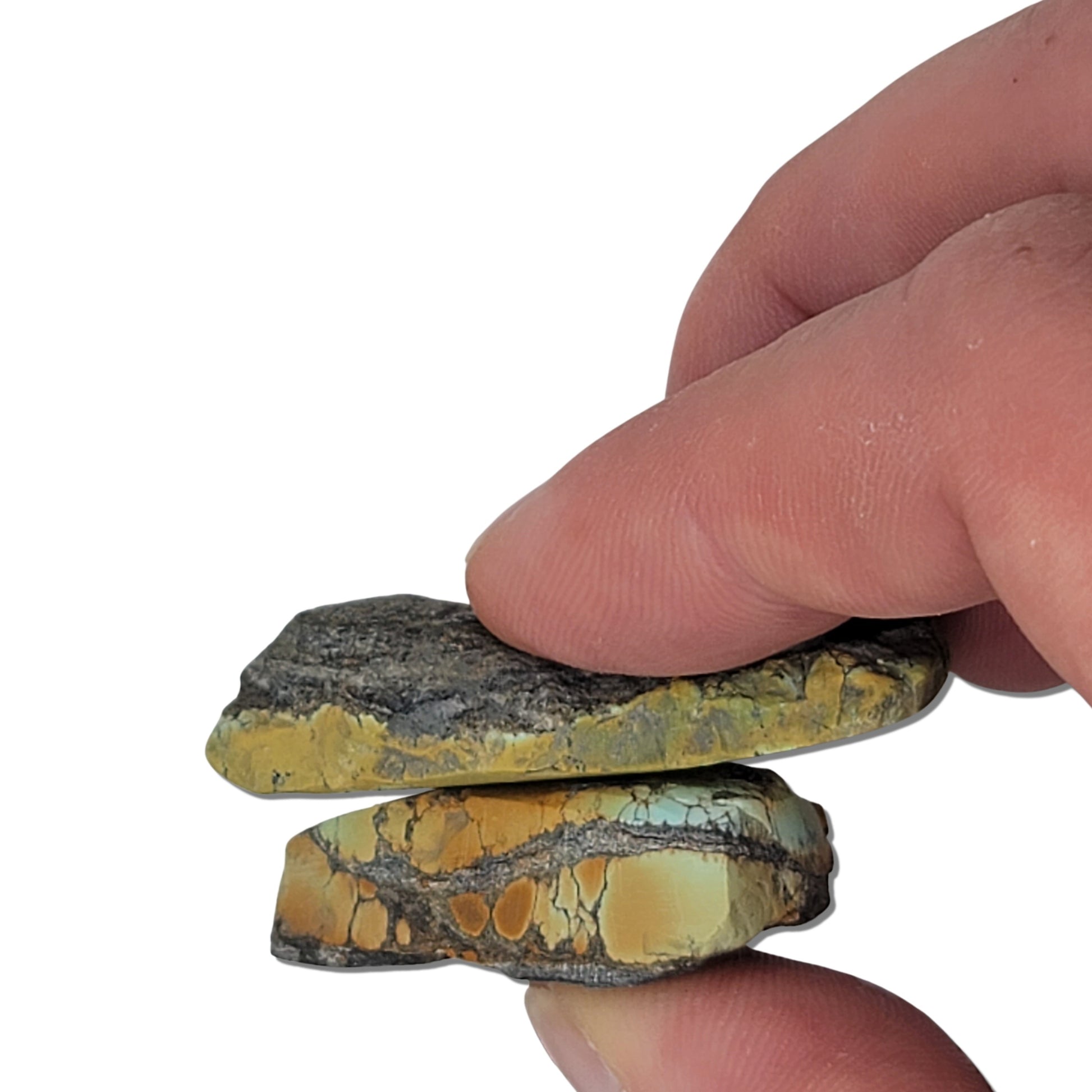 Two rough turquoise stones with earthy green and brown hues and dark matrix, approx. 4 cm x 3 cm and 3 cm x 2 cm, www.naturalturquoise.com