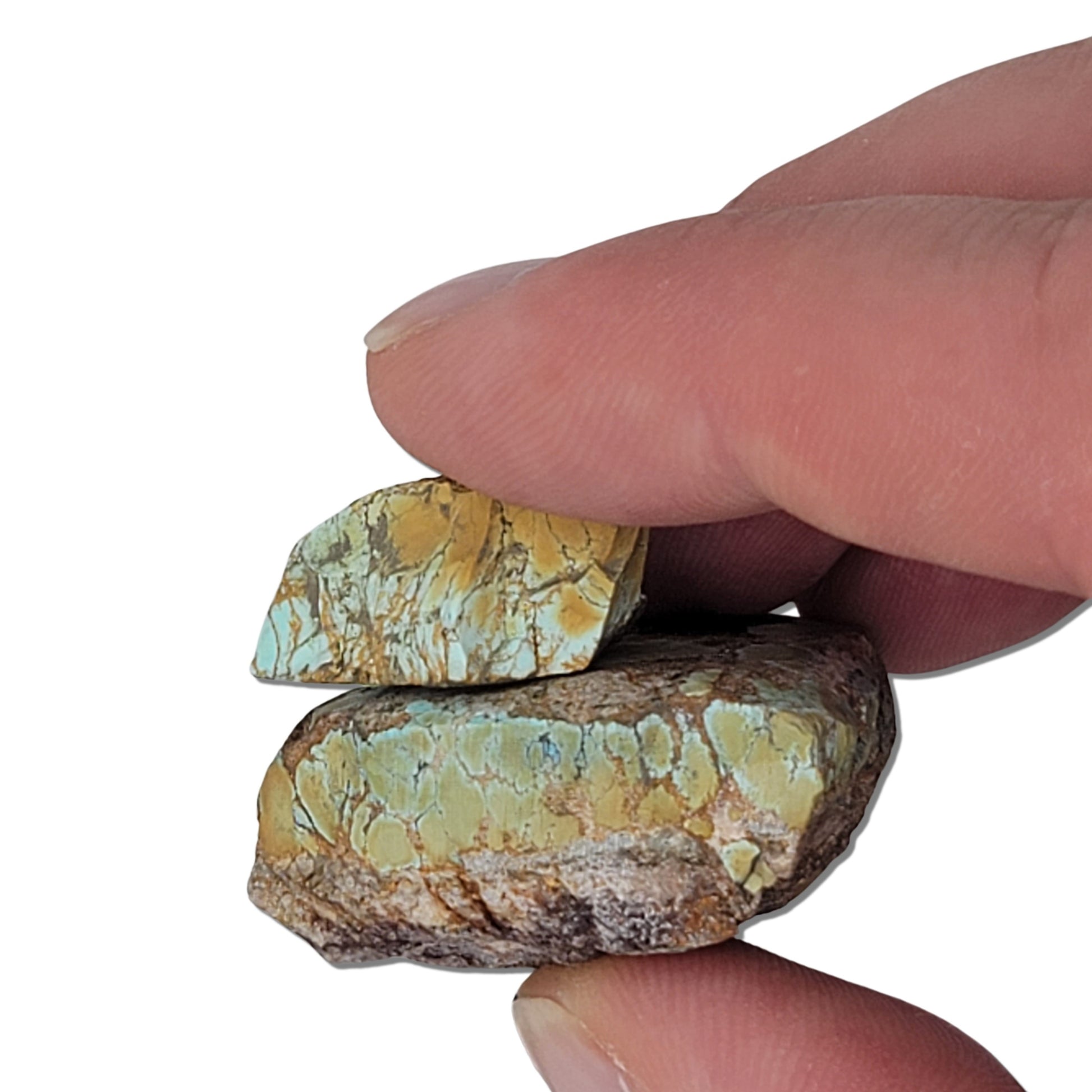 Two rough turquoise stones with greenish-blue tones and earthy brown matrix, approx. 4 cm x 3.5 cm and 2.5 cm x 1.5 cm, www.naturalturquoise.com.