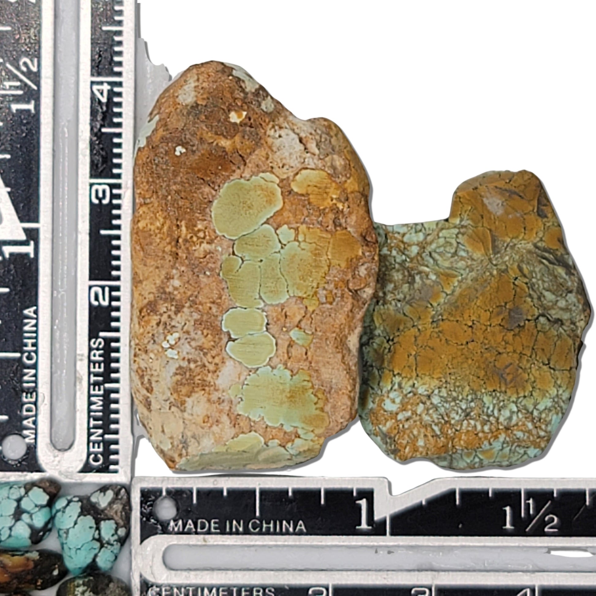 Two rough turquoise stones with earthy brown and green hues and subtle matrix patterns, approx. 4 cm x 2.5 cm and 3 cm x 2 cm, www.naturalturquoise.com.