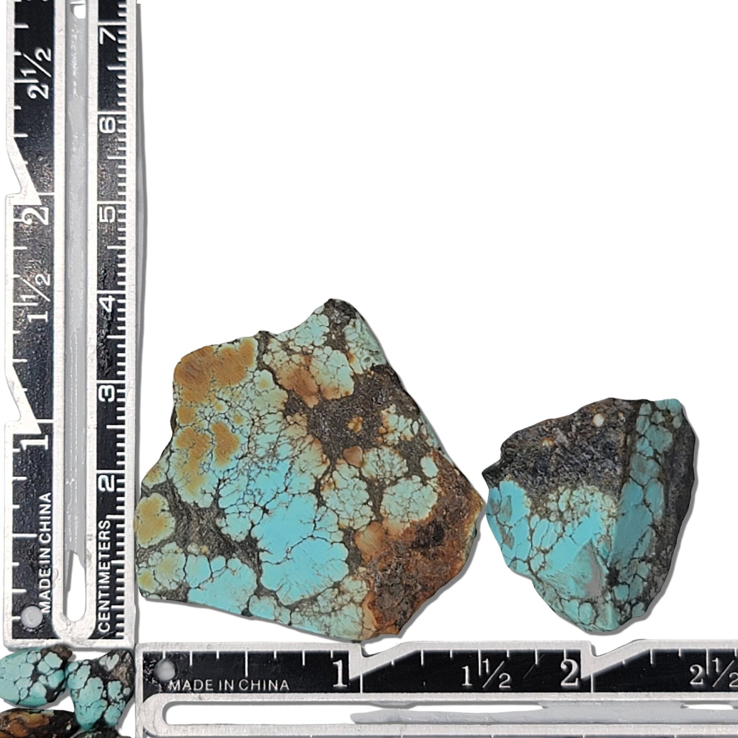 Two rough turquoise stones with vibrant blue and earthy brown matrix patterns, approx. 4 cm x 3.5 cm and 2.5 cm x 2 cm, www.naturalturquoise.com.