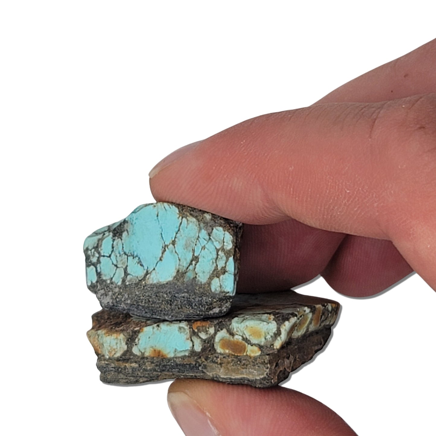 Two rough turquoise stones with vibrant blue and earthy brown matrix patterns, approx. 4 cm x 3.5 cm and 2.5 cm x 2 cm, www.naturalturquoise.com.