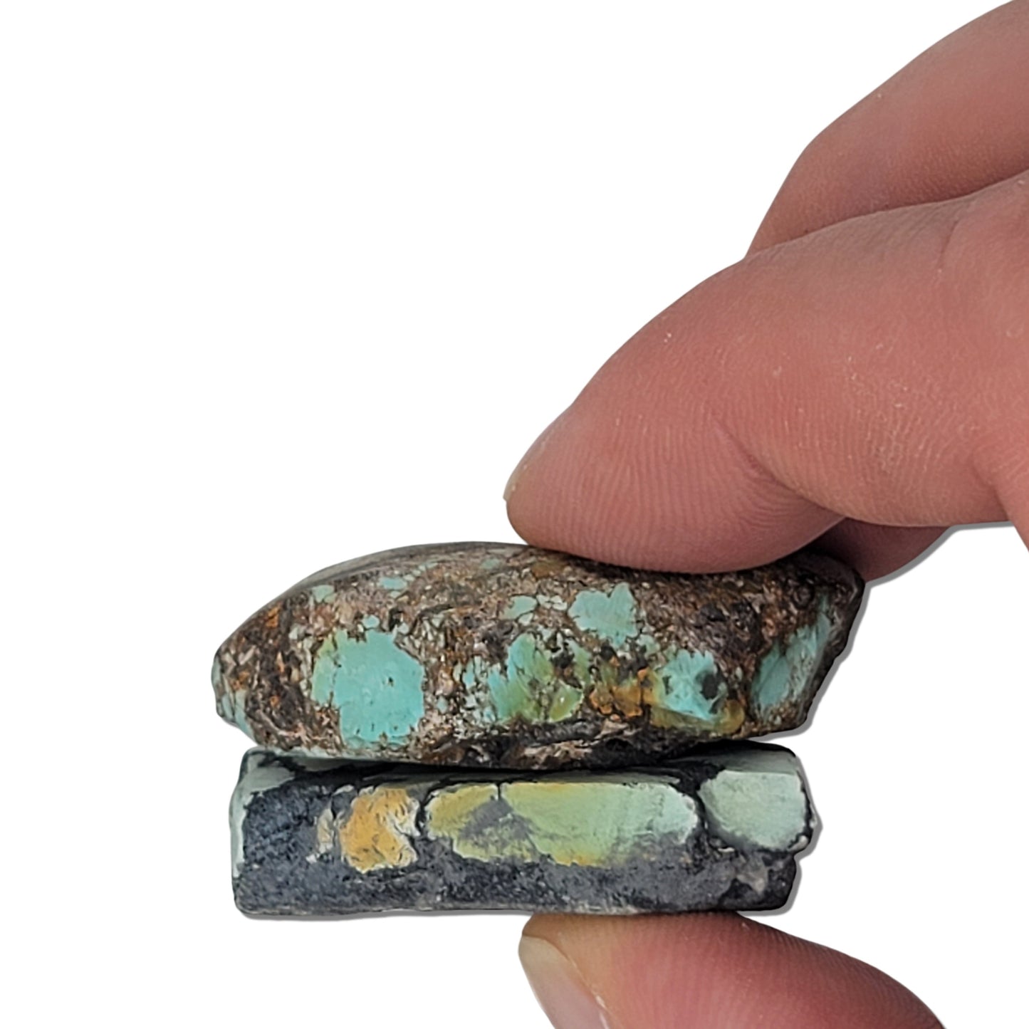 Two rough turquoise stones with greenish hues and dark matrix patterns, approx. 4 cm x 2 cm and 3.5 cm x 2.5 cm, www.naturalturquoise.com.