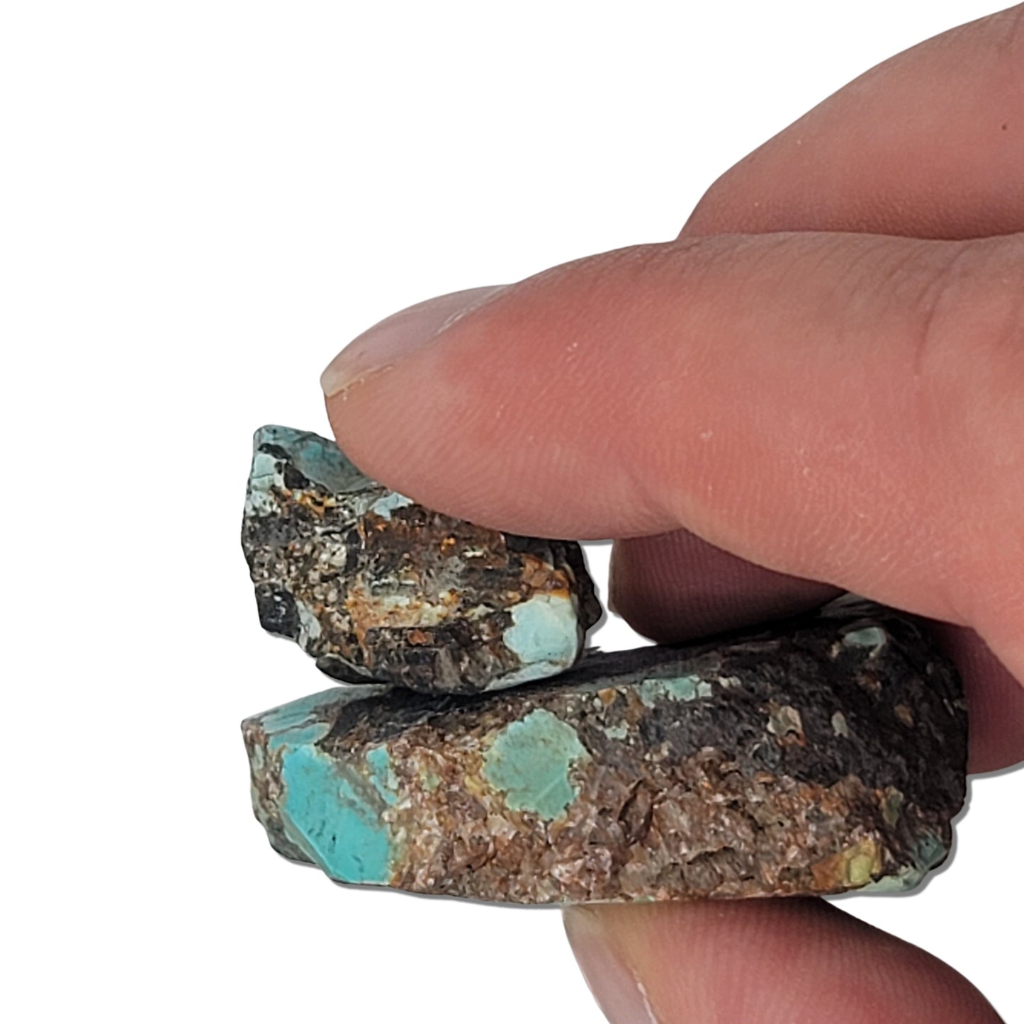 Two rough turquoise stones with green and brown tones and dark matrix, approx. 4 cm x 3 cm and 2 cm x 1.5 cm, www.naturalturquoise.com.