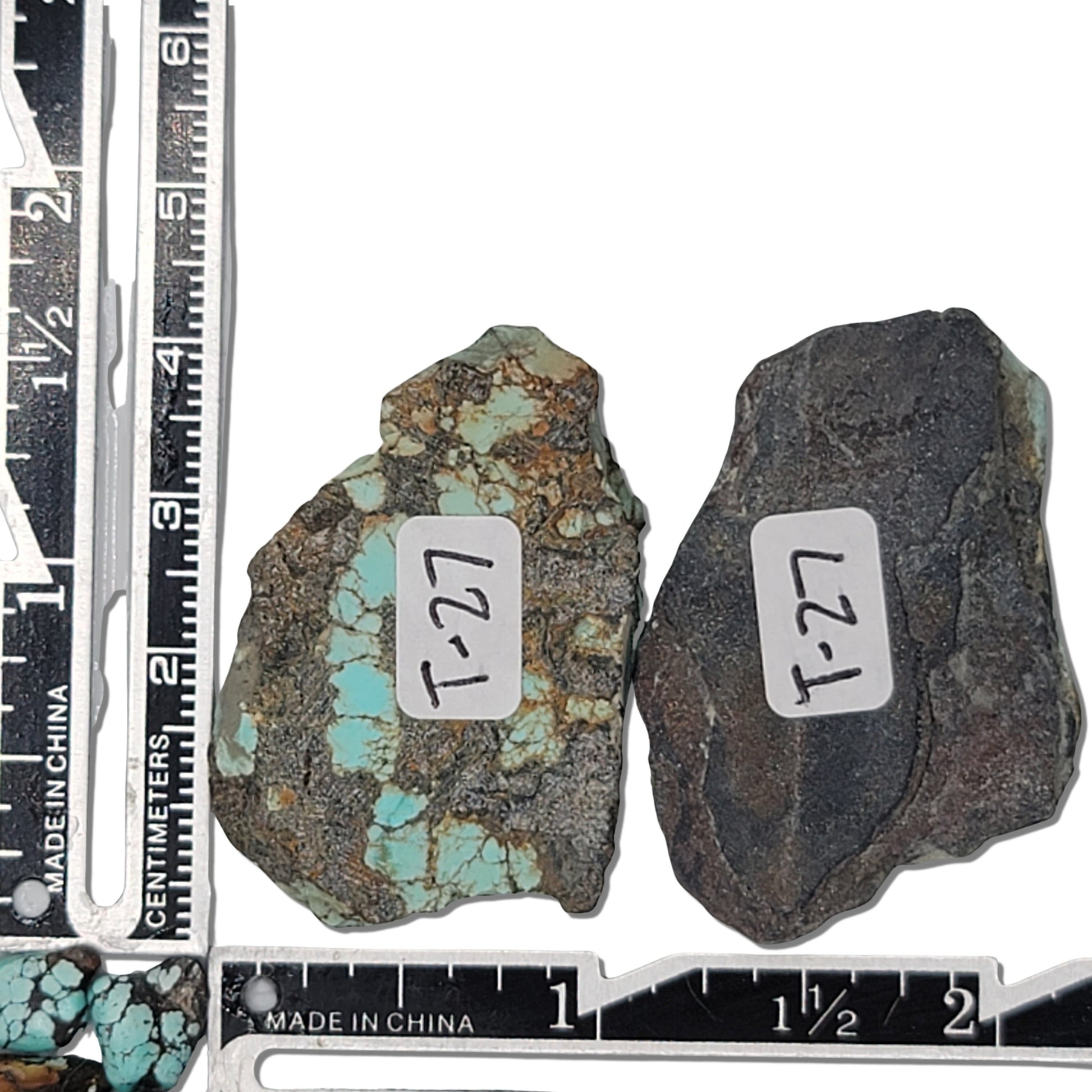 Two rough turquoise stones with light blue hues and natural earthy matrix, approx. 4 cm x 3 cm and 3.5 cm x 2.5 cm, www.naturalturquoise.com."