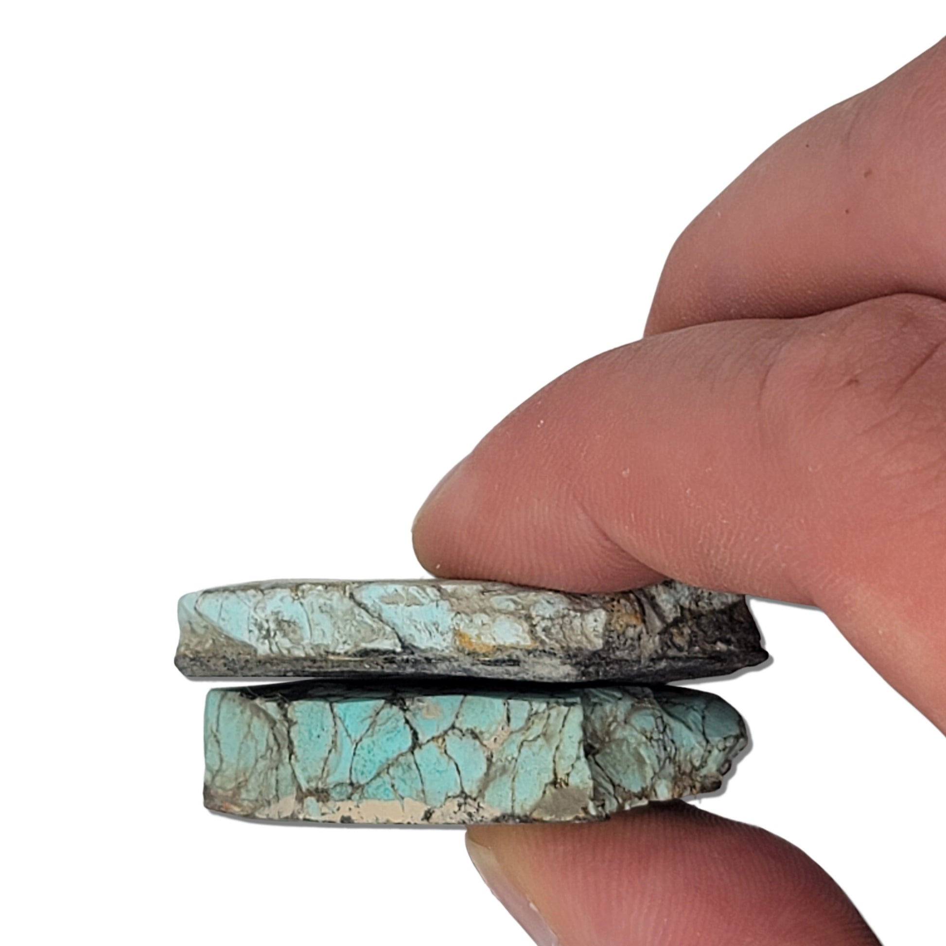 Two rough turquoise stones with light blue hues and natural earthy matrix, approx. 4 cm x 3 cm and 3.5 cm x 2.5 cm, www.naturalturquoise.com."