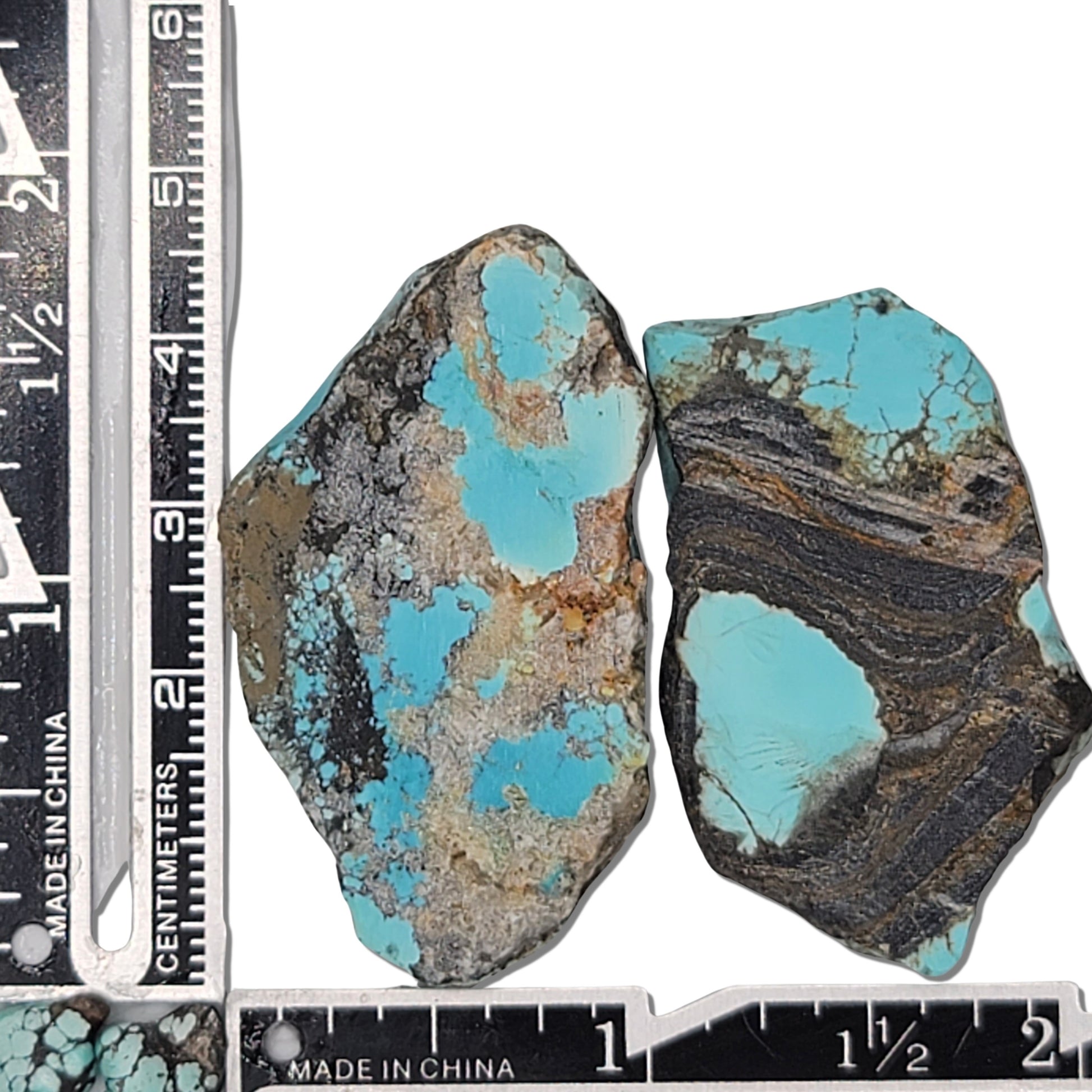 Two rough turquoise stones with vivid blue and dark brown matrix patterns, approx. 4 cm x 2.5 cm and 3.5 cm x 2 cm, www.naturalturquoise.com