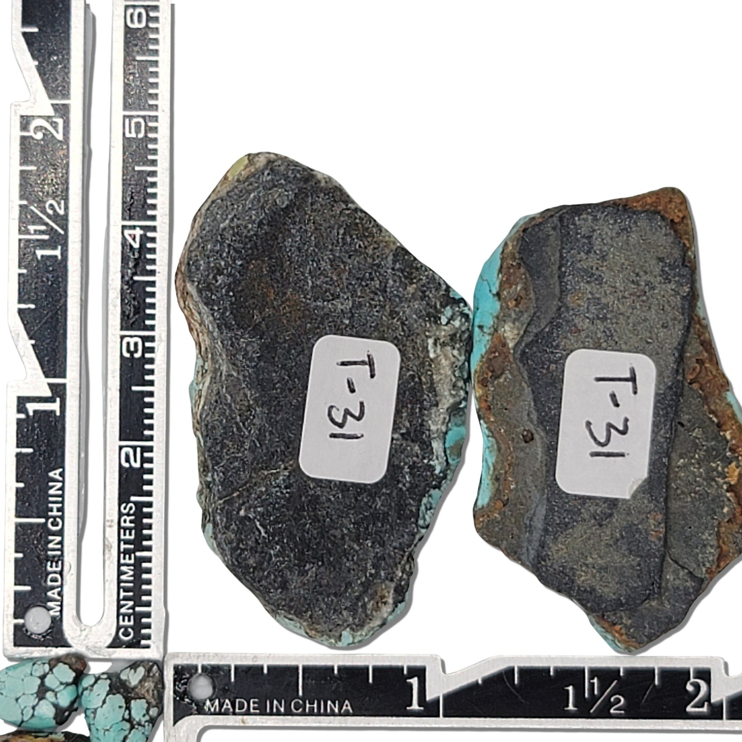 Two rough turquoise stones with vivid blue and dark brown matrix patterns, approx. 4 cm x 2.5 cm and 3.5 cm x 2 cm, www.naturalturquoise.com