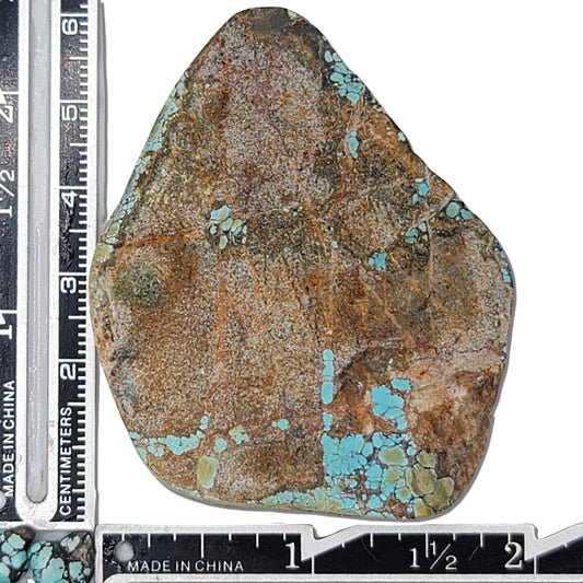 Single rough turquoise stone with earthy brown tones and patches of blue, approx. 5 cm x 4 cm, www.naturalturquoise.com.