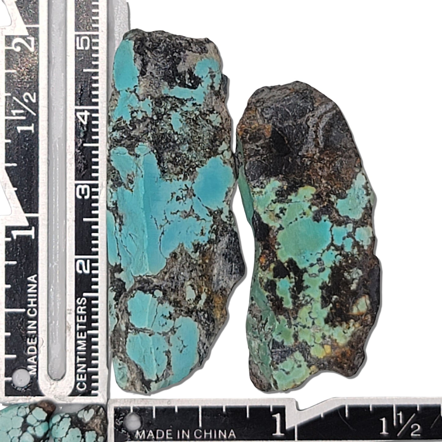 Two rough turquoise stones with blue and green hues and dark matrix, approx. 5 cm x 2 cm and 4.5 cm x 2 cm, www.naturalturquoise.com