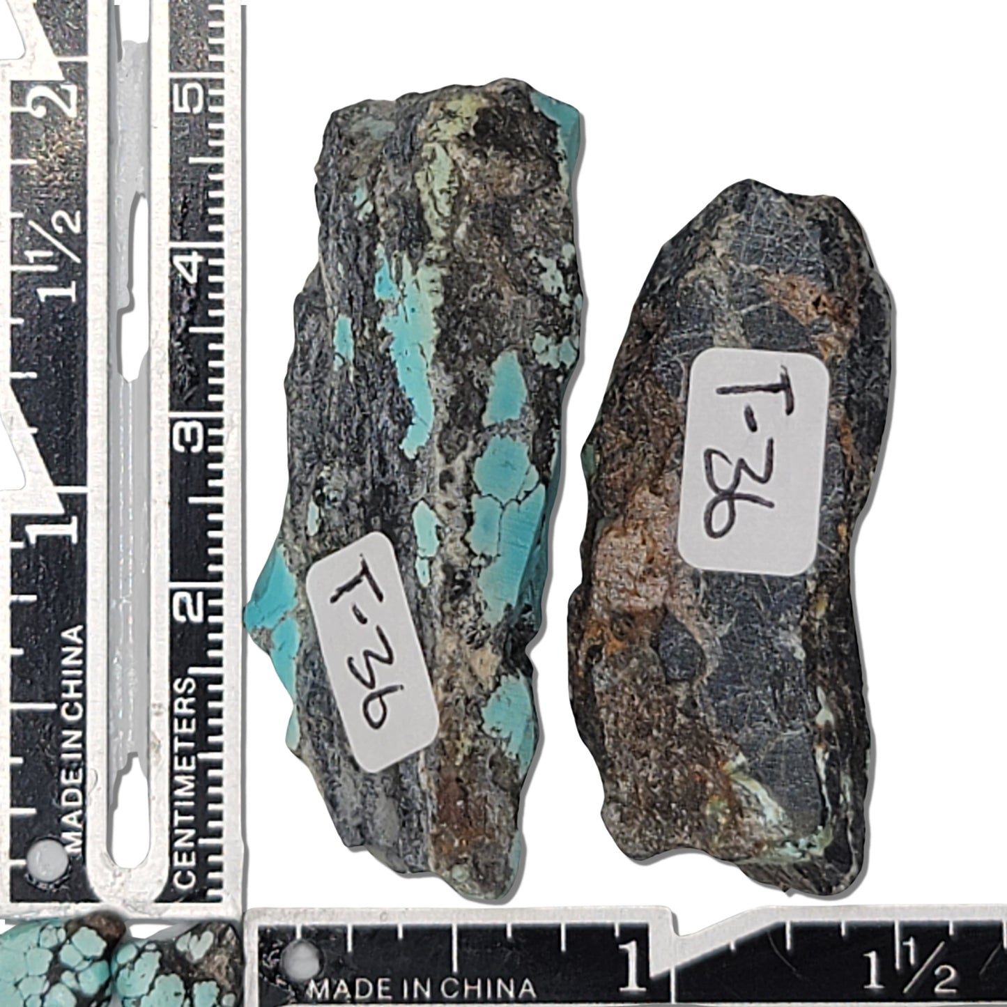 Two rough turquoise stones with blue and green hues and dark matrix, approx. 5 cm x 2 cm and 4.5 cm x 2 cm, www.naturalturquoise.com