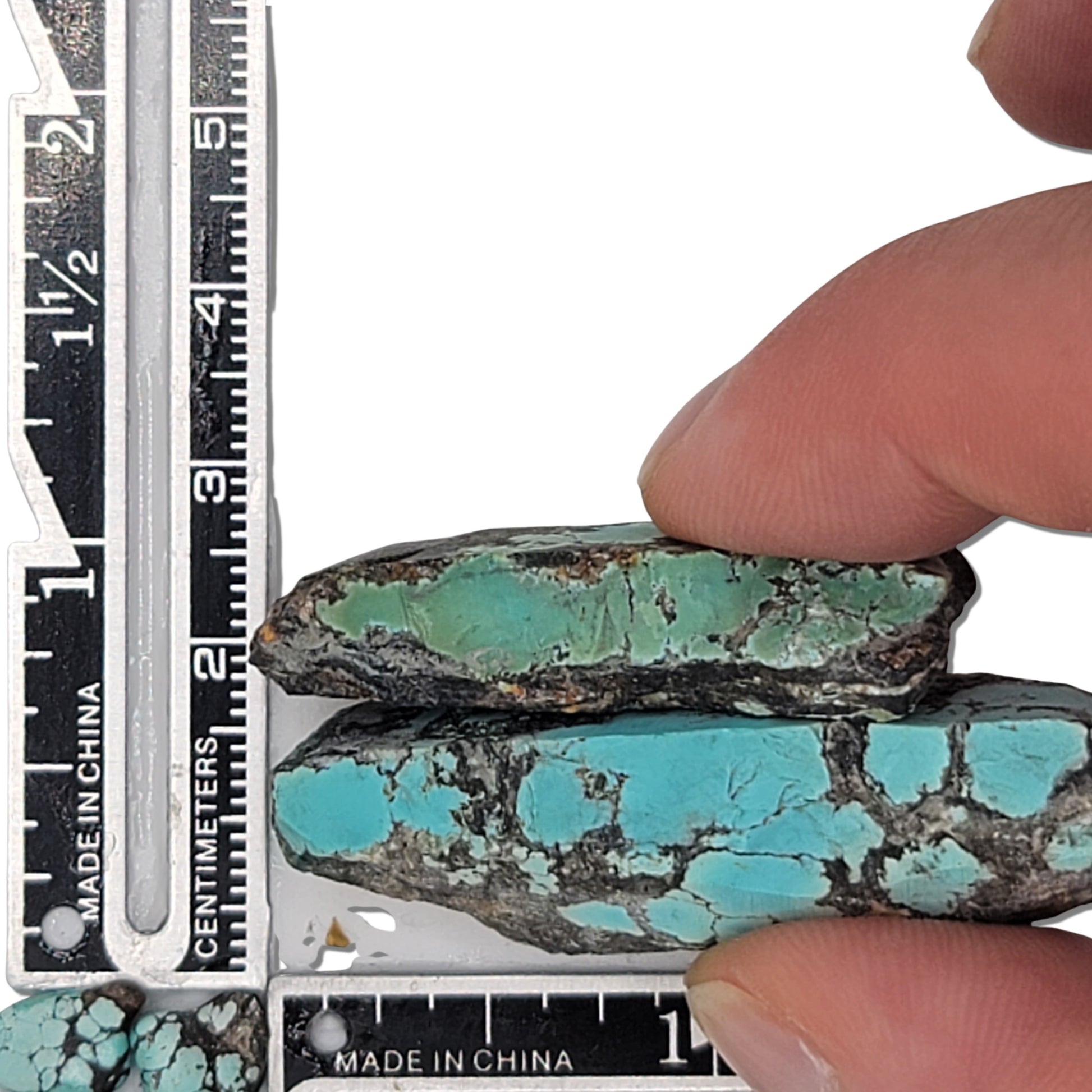 Two rough turquoise stones with blue and green hues and dark matrix, approx. 5 cm x 2 cm and 4.5 cm x 2 cm, www.naturalturquoise.com