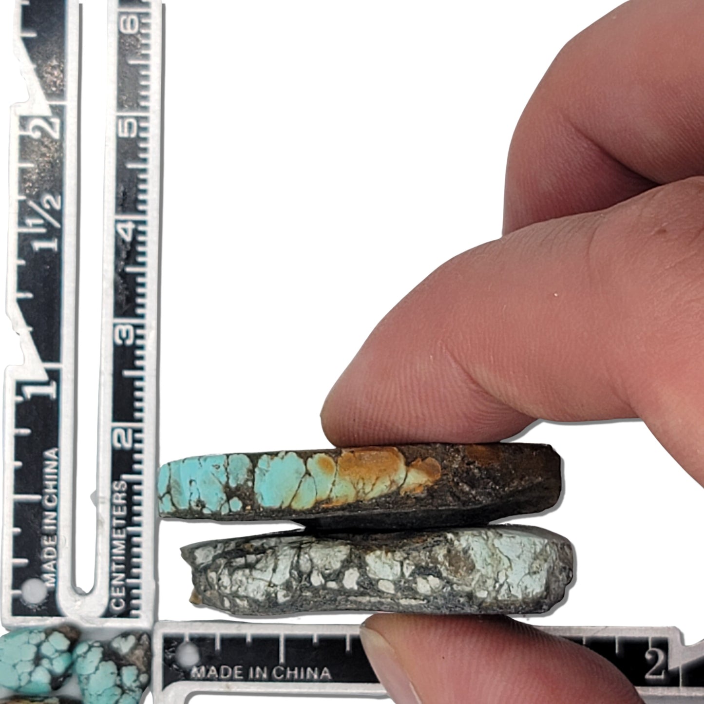 Two rough turquoise stones with intricate blue and earthy matrix patterns, approx. 4.5 cm x 2.5 cm and 4 cm x 3 cm, www.naturalturquoise.com.