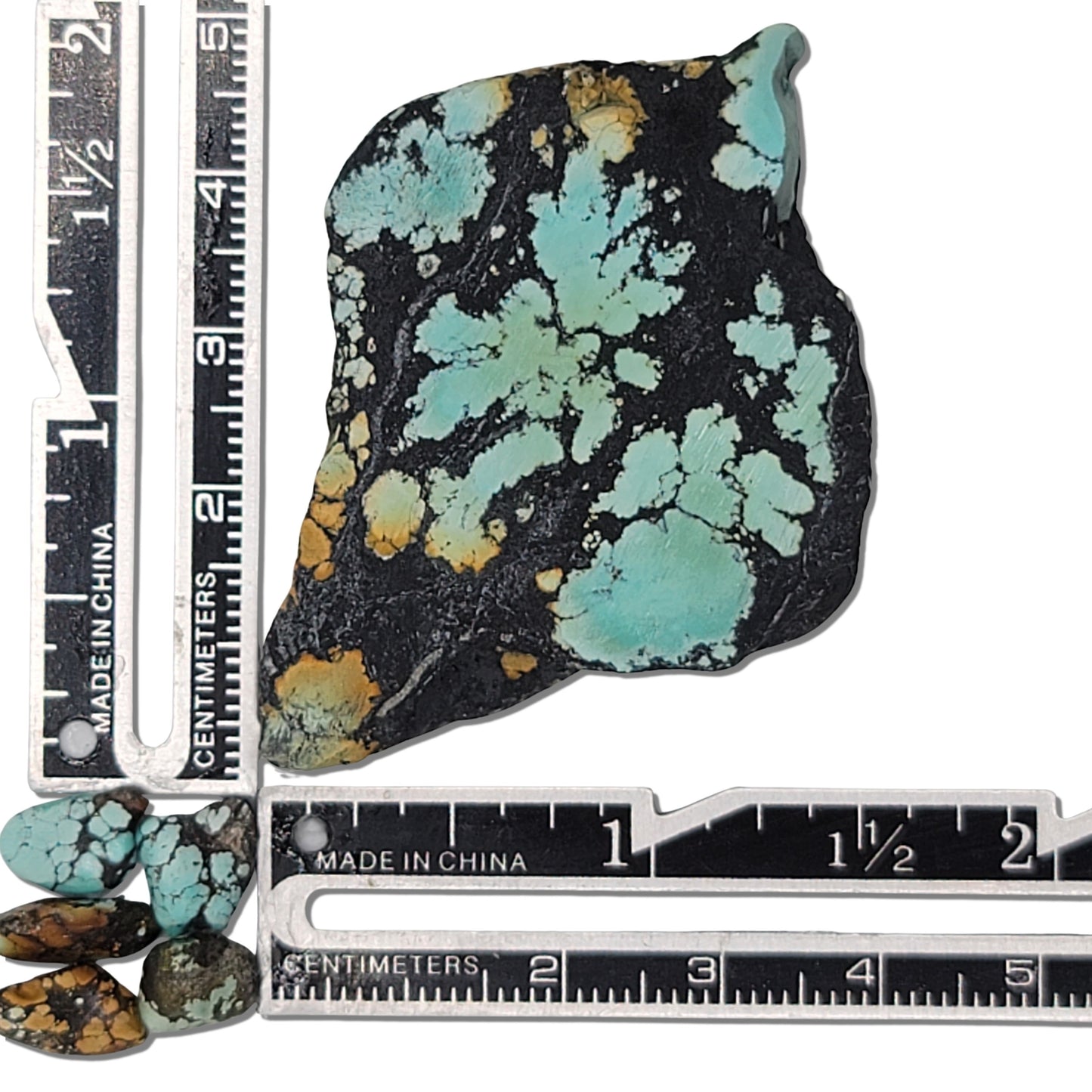 Single rough turquoise stone with vibrant green and blue patches and a dark matrix, approx. 4 cm x 3 cm, www.naturalturquoise.com