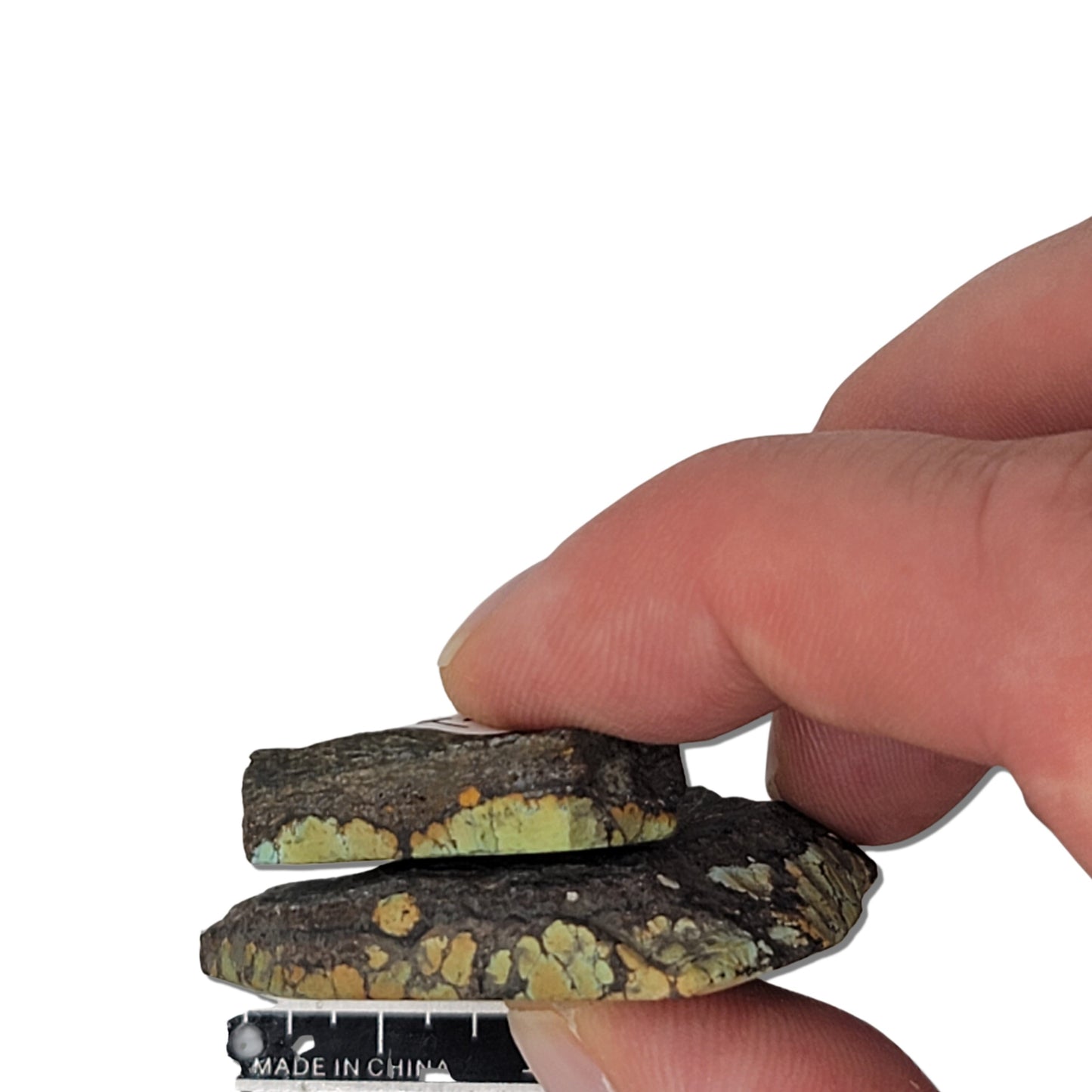 Pair of natural Hubei turquoise stones, 24g total, green and brown hues with black matrix, larger stone approx. 4.5 cm x 4 cm, smaller approx. 2.5 cm x 2 cm