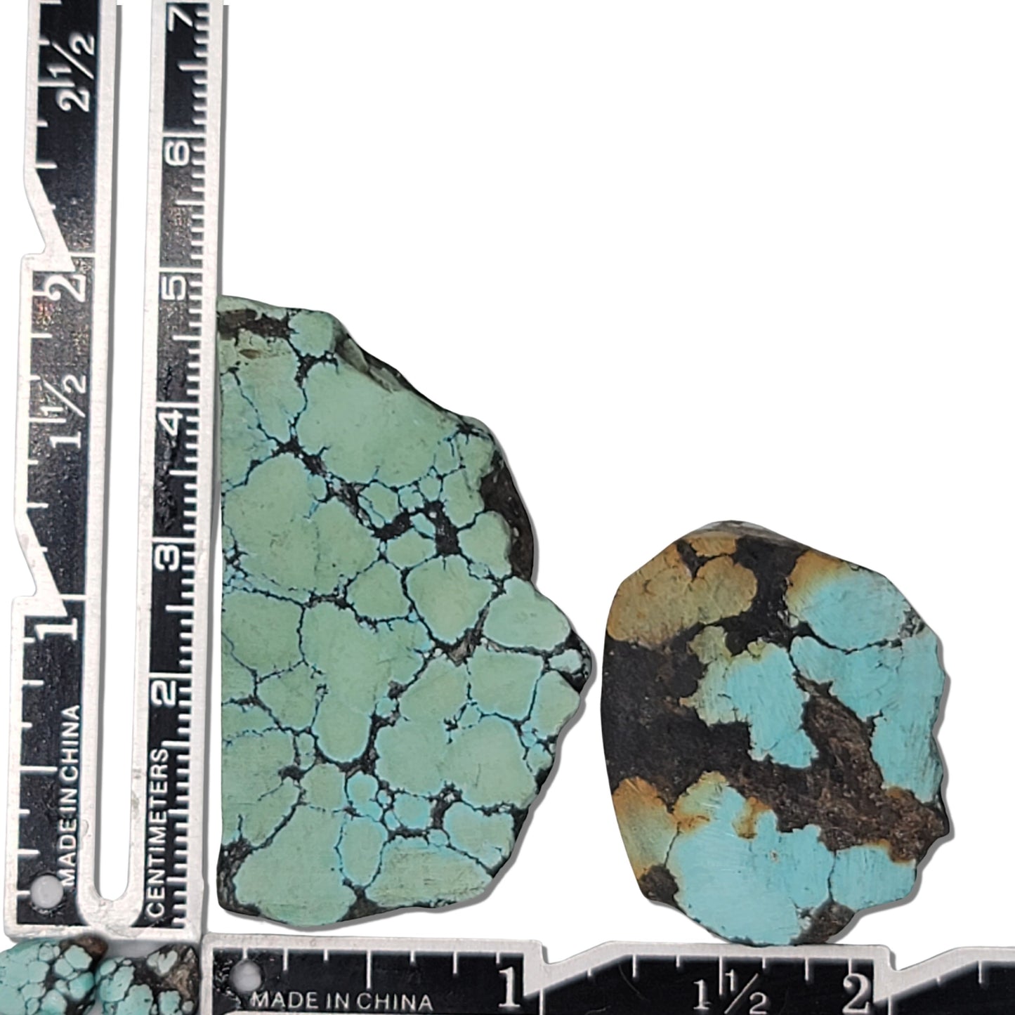 Two rough turquoise stones with blue webbing and dark matrix, approx. 4.5 cm x 3 cm and 3 cm x 2.5 cm, www.naturalturquoise.com