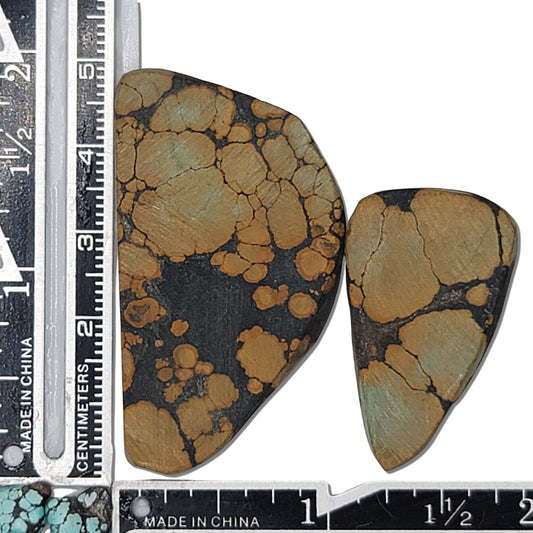 Pair of Hubei turquoise stones, 20g total, tan and golden patterns on dark matrix, unique shapes, approx. 4 cm x 2.5 cm and 3 cm x 1.5 cm, www.naturalturquoise.com.