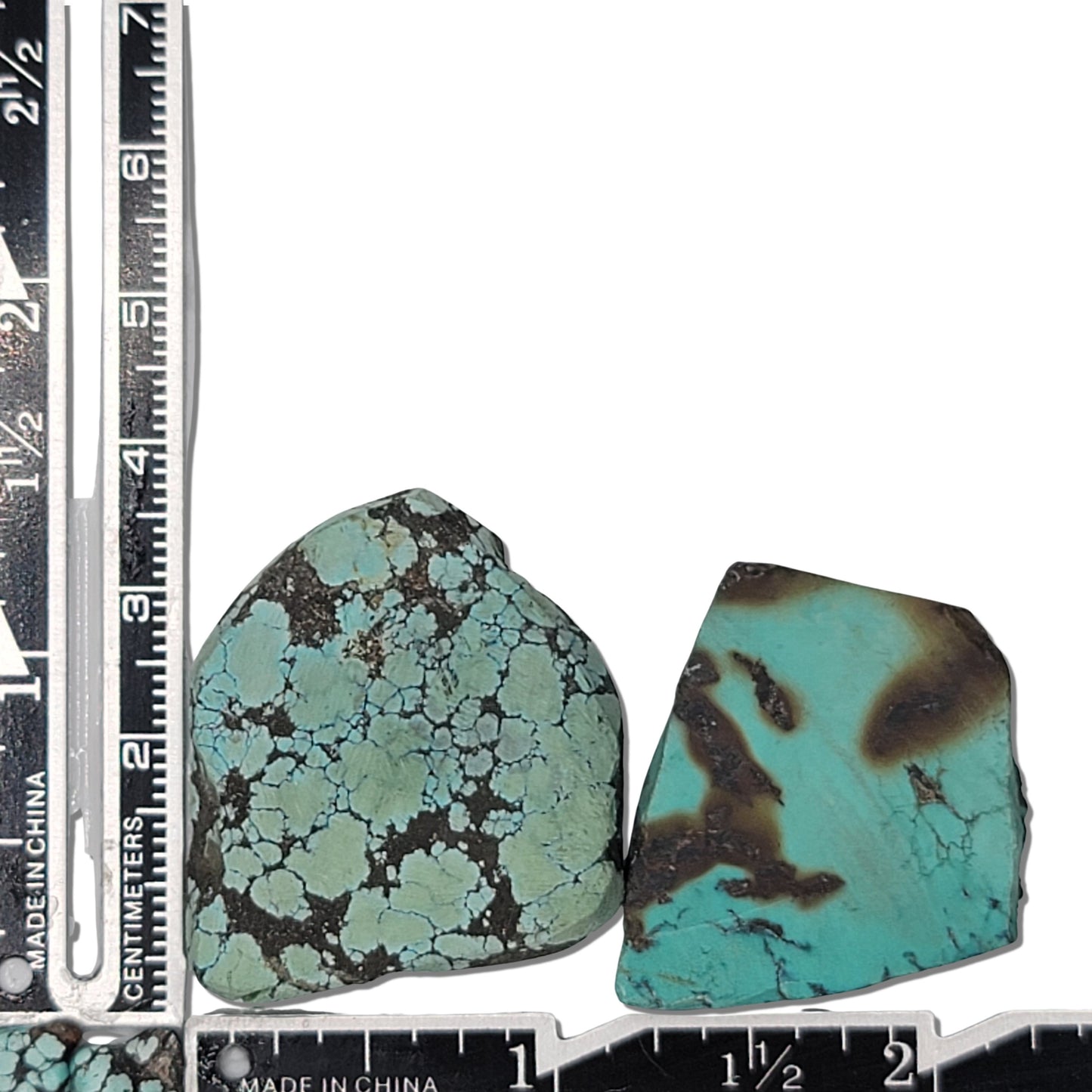 Two rough turquoise stones with blue-green hues and dark earthy matrix, approx. 4 cm x 3 cm and 4 cm x 3 cm, www.naturalturquoise.com