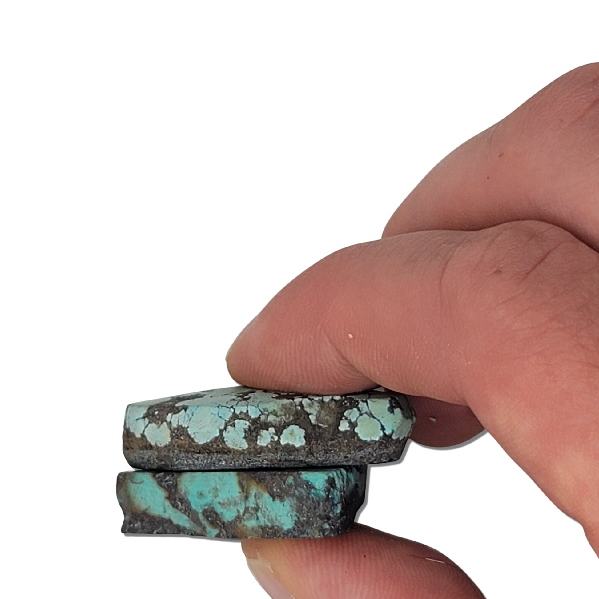 Two rough turquoise stones with blue-green hues and dark earthy matrix, approx. 4 cm x 3 cm and 4 cm x 3 cm, www.naturalturquoise.com