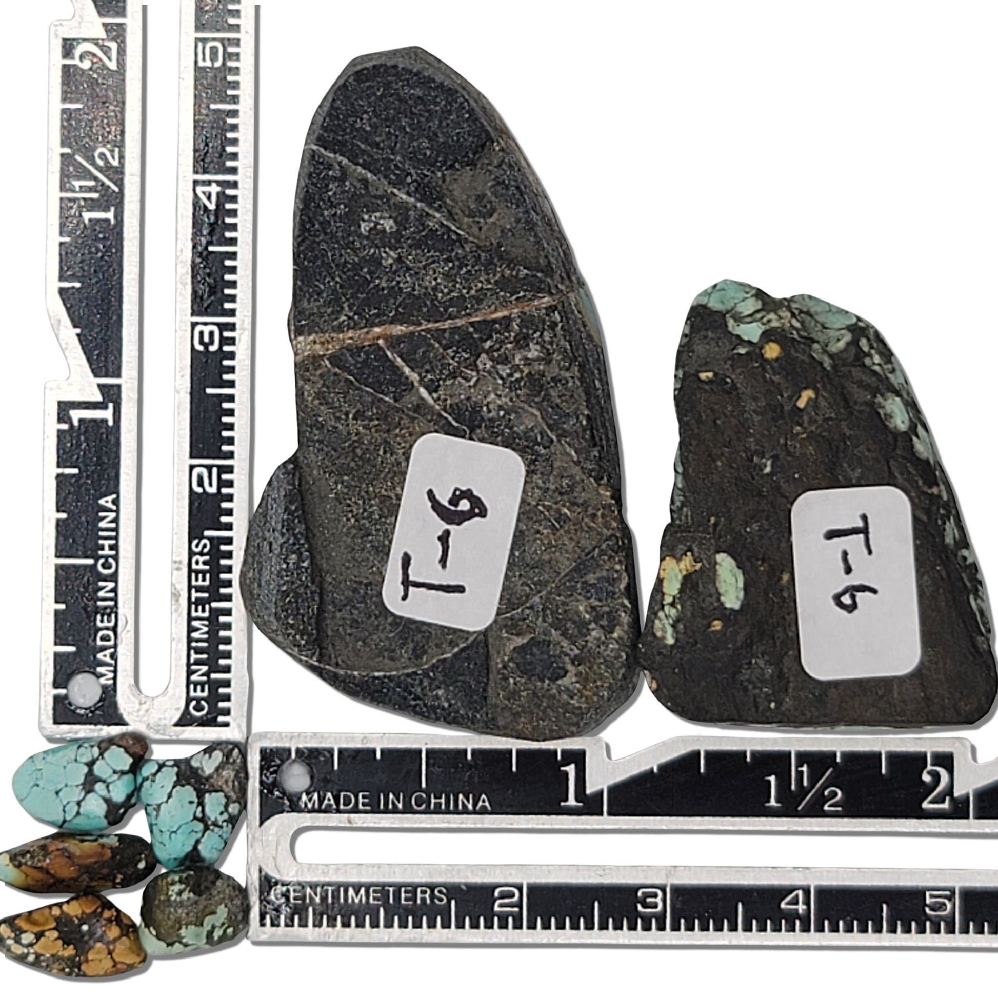 Two rough turquoise stones with striking blue webbing and dark earthy matrix, approx. 4 cm x 2.5 cm and 3.5 cm x 2 cm, www.naturalturquoise.com.