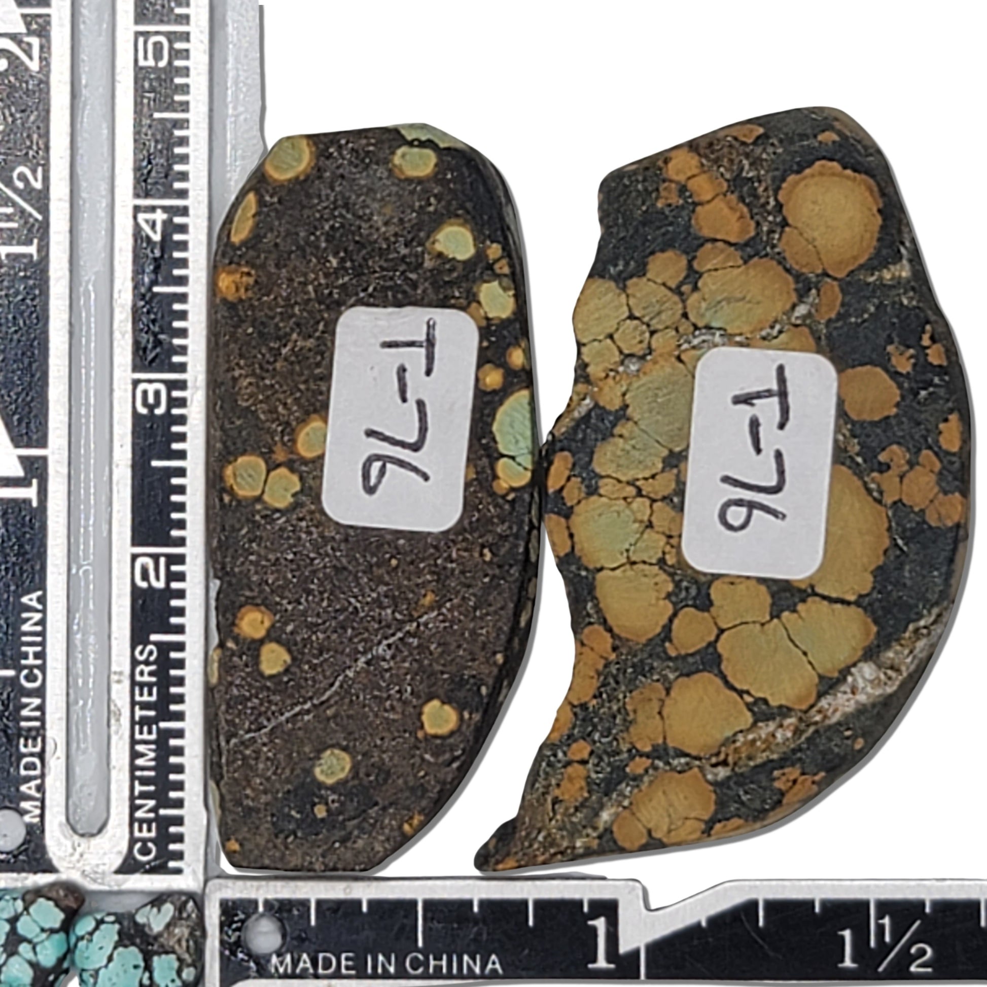 A pair of natural turquoise stones weighing 19 grams, featuring earthy golden tones with green highlights and bold dark matrix patterns. The stones measure approximately 4.5 cm x 2 cm and 4 cm x 2.3 cm, displayed with a ruler for scale. Available for purchase at www.naturalturquoise.com, ideal for lapidary and jewelry projects.