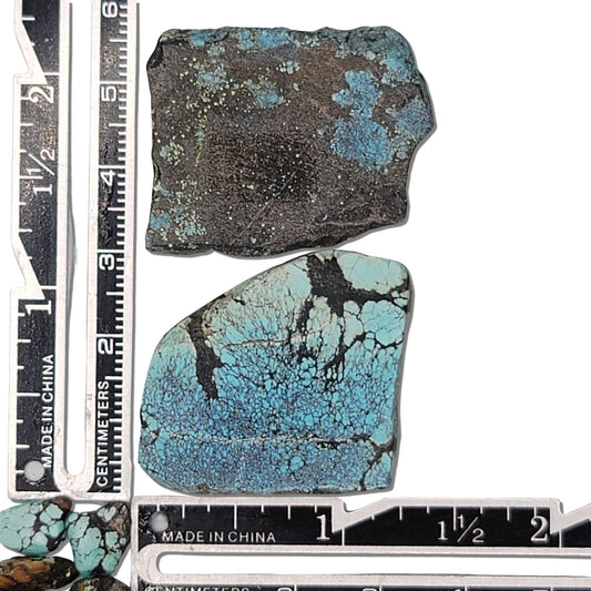 Two rough turquoise stones with rich blue hues and dark earthy matrix, approx. 3.5 cm x 2.5 cm and 3 cm x 2 cm, www.naturalturquoise.com