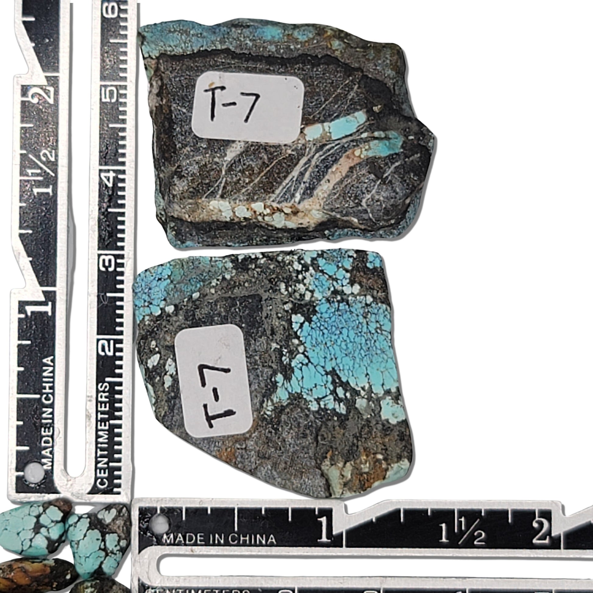 Two rough turquoise stones with rich blue hues and dark earthy matrix, approx. 3.5 cm x 2.5 cm and 3 cm x 2 cm, www.naturalturquoise.com