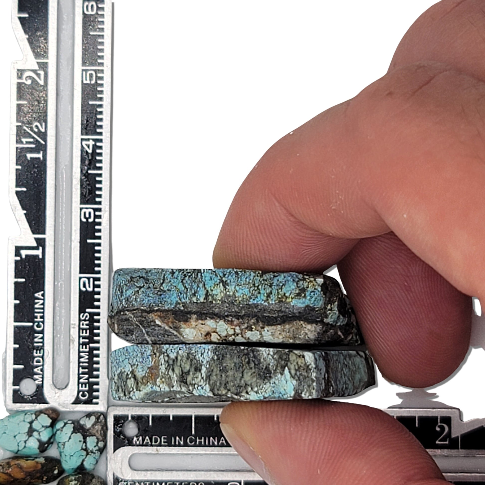 Two rough turquoise stones with rich blue hues and dark earthy matrix, approx. 3.5 cm x 2.5 cm and 3 cm x 2 cm, www.naturalturquoise.com