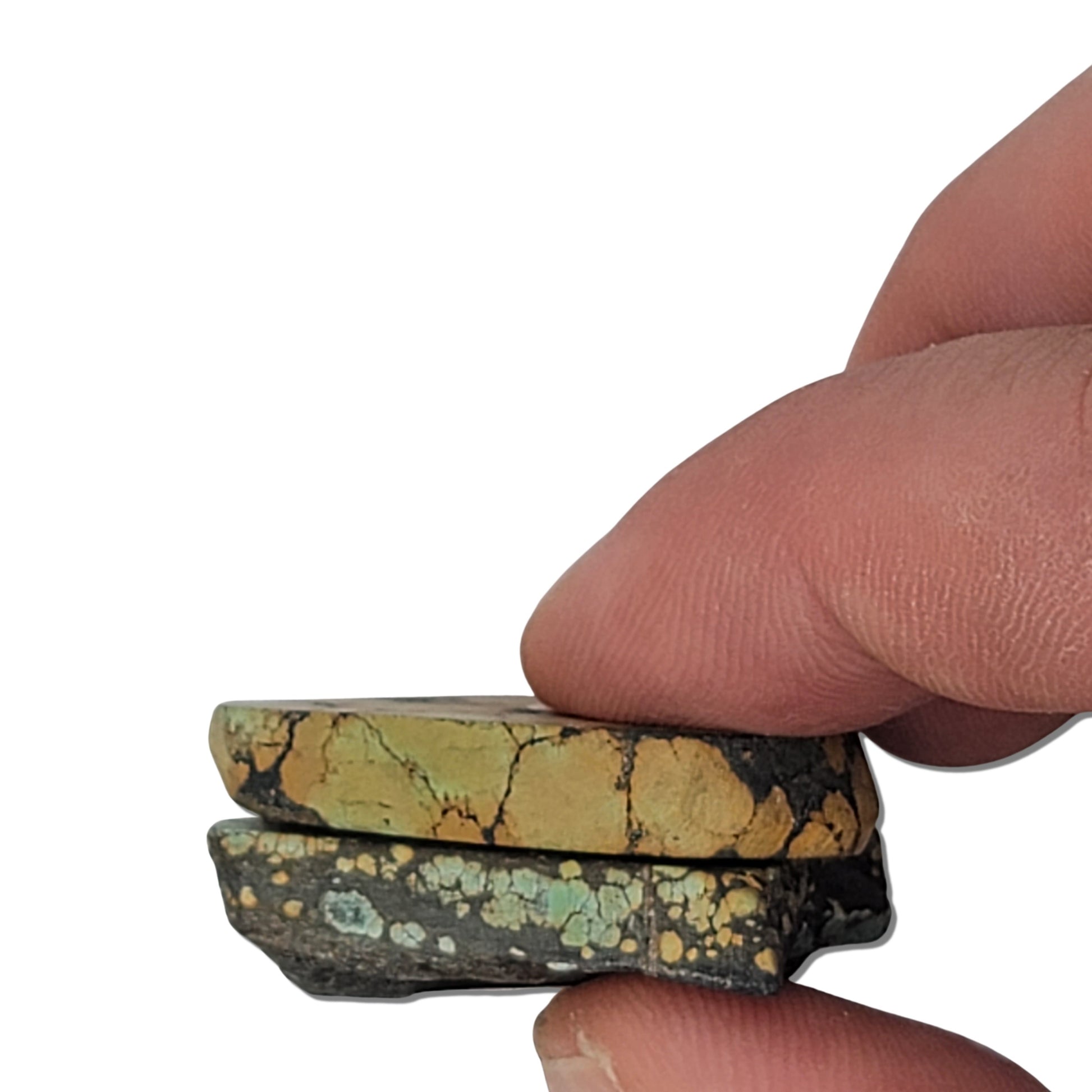 A pair of natural turquoise stones weighing 18 grams, featuring light green and golden tones with bold dark matrix patterns. The stones measure approximately 4.2 cm x 3 cm and 3.5 cm x 2.7 cm, displayed with a ruler for scale. Available for purchase at www.naturalturquoise.com, ideal for lapidary and jewelry projects.