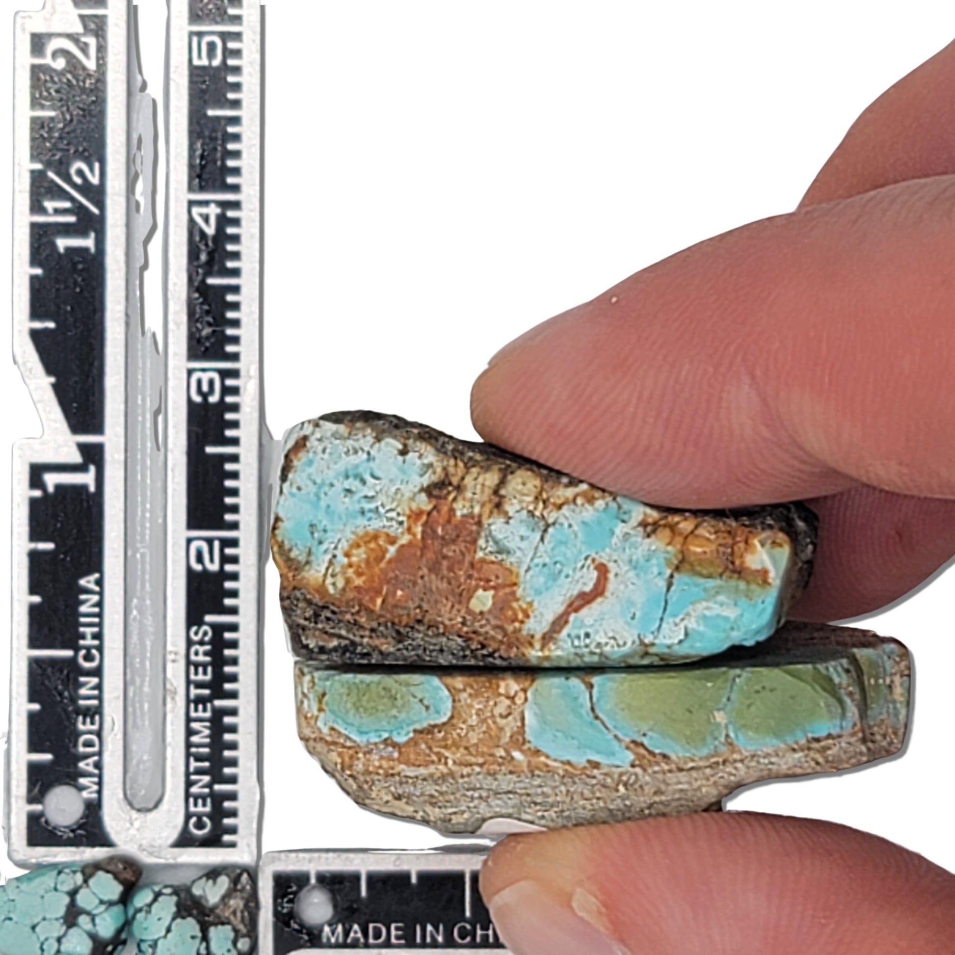 A pair of 17-gram natural turquoise rough stones featuring sky blue hues with brown and gold matrix patterns. The largest stone measures approximately 4.0 cm x 2.0 cm x 0.6 cm. Ideal for jewelry design or lapidary projects, available at www.naturalturquoise.com.






